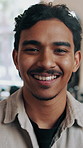Wellness, face and man in home with portrait, positive attitude and optimistic for weekend break. Upbeat, smile and happy person in living room with good mood, confidence and satisfaction on day off.