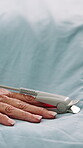Hand, healthcare and space with patient in hospital bed for healing, recovery or treatment. Oxygen monitor, medical care and rest with senior person in clinic for assistance, help or wellness