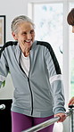 Physiotherapy, old woman or rail in practice for balance, rehabilitation or injury recovery. Smile, physiotherapist or senior person with disability at bar, stability or assistance in consultation