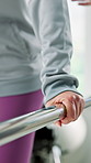 Physiotherapy, hands and rail in practice for balance, rehabilitation and injury recovery. Person, physiotherapist and walking at bar for stability, help and assistance with movement in consultation