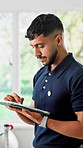 Physiotherapist, man and research in clinic with tablet, patient history or plan for rehabilitation. Physical therapy, person and scroll in office with tech, medical report or website for healthcare.