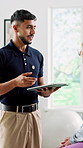 Tablet, man and patient consultation with physical therapist for healthcare, rehabilitation or recovery. Chiropractor, person and talk with client, tech or diagnosis with medical healing at clinic