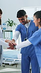Happy, doctor and team with hands together in hospital for motivation, collaboration or unity. Group, healthcare workers or piling with stack or smile for solidarity, trust or support in clinic