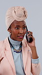 Angry, annoyed or black woman with phone call in studio for scam or fraud on a gray background. Frustrated, female person or yelling with smartphone or stress for difficult discussion or conversation