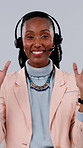 Face, consultant or black woman with headset in studio for virtual assistance on a gray background. Portrait, happy agent or female person with smile, mic or explanation for online advice or CRM help