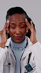 Doctor, headache and black woman with stress in studio for mistake or failure on a gray background. Frustrated, female person or healthcare worker with migraine, strain or anxiety or medical pressure