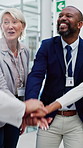 Happy, doctor and hands together with team in hospital for unity, collaboration or motivation. Excited group, people or medical employees piling with smile or stack for health success or celebration