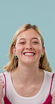 Face, woman and excited in studio with fist pump, achievement and announcement of lottery winner. Happy, person cheering and celebration with giveaway promotion, prize and success on blue background.