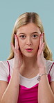 Stress, thinking and face of woman in studio for confused, anxious or doubt reaction with worry. Upset, unsure and portrait of person with choice, mistake or pressure of decision on blue background.