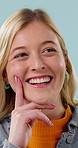 Thinking, happy and woman in studio with problem solving, solution or decision on creative career. Smile, choice and person by blue background with idea, planning or brainstorming for project.