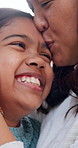 Face, mother and kiss child for care, love and embrace with happy daughter for connection at home. Smile, parent and hug girl in living room with trust, safety or family bonding together for security