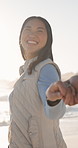Travel, holding hands and smile with couple at beach for romantic getaway, vacation and connection. Anniversary holiday, tropical adventure and love with man and woman outdoor for date and trust
