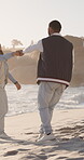 Travel, dance and love with couple at beach for romantic getaway, vacation and connection. Anniversary holiday, holding hands and laughing with man and woman outdoor for date, spin and trust