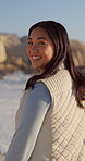 Smile, walking and face with woman at beach for summer vacation, sunset and ocean getaway. Happiness, seaside trip and travel with person outdoor for holiday, weekend break and tropical island