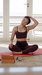 Woman, yoga and stretching in home with tablet, watch video tutorial or holistic health for wellness. Active, person and warm up in house with tech, fitness and streaming online class for exercise.