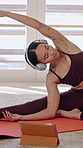 Yoga, woman and online class in home with headphones, tablet and watch video tutorial for stretching. Female person, warm up and fitness in house with audio tech, virtual lesson and how to exercise.