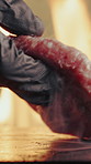 Hand, flame and chef with burger for restaurant, cooking and fast food for lunch service. Takeaway, person and hamburger on grill in kitchen for meal prep, nutrition or frying beef for barbecue