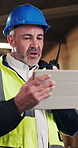 Man, engineer and tablet in workshop with radio, planning or update in work schedule. Mature project manager, tech or reading in factory for efficient production, communication or report feedback