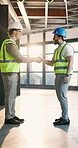 Engineering, handshake and smile with people in office for architect contract, meeting and partnership. Thank you, welcome and contractor with employees shaking hands in agency for project agreement