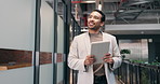Finance, tablet and thinking with businessman walking in office corridor for planning or research. App, financial review and schedule with happy employee in workplace hallway for digital report