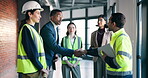 Architect, handshake and team with tablet in meeting, thank you or agreement for renovation project. Civil engineer, shaking hands and people with tech, happy and planning for property development