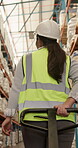 Pallet jack, shipping and back of woman in warehouse for logistics, inventory management and cargo. Supply chain supervisor, freight inspection and distribution depot with person and trolley