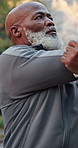 Fitness, stretching and senior man outdoor for health, exercise preparation or injury prevention. Warm up, black person or getting ready for workout, wellness or arm flexibility for active retirement