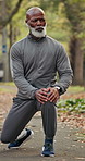 Fitness, old man or stretching outdoor with music for health, exercise preparation or streaming radio. Warm up, black person or start workout on road, wellness or earphones for active retirement