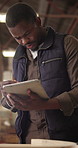 Carpenter, man and design in workshop with tablet, stylus or problem solving for lumber production. Flare, black person and woodwork designer in factory with digital tech, planning and manufacturing.
