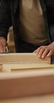 Hands, sandpaper and man smooth wood for carpenter job, woodwork and manufacturing warehouse. Person, productivity and process for texture in workshop with custom or handmade timber furniture