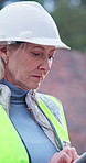 Tablet, woman and typing on construction site for architect, management and property development. Tech, scroll and mature civil engineer with inspection for maintenance safety, repairs or renovation