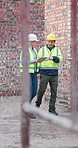 Tablet, team and conversation on construction site for engineer, inspection and property development. Tech, discussion and mature architect with people for maintenance, repairs or renovation safety