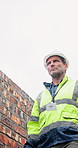 Thinking, man and walk at site for construction, inspection and renovation for architecture. Below, mature person or steps at worksite for upgrade, quality control and repairs of building development