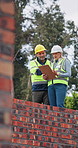 Clipboard, discussion and construction workers site with planning building, repairs or renovation. Checklist, rooftop and civil engineer with manager for property development, project or maintenance.