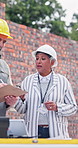 Woman, talking and clipboard at site for construction, discussion and report for architecture. Team, meeting and checklist for inspection, conversation and compliance survey for building development