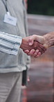 Construction, handshake or people with approval, agreement or introduction in site inspection. Partnership, networking or engineer with shaking hands, greeting or clearance in compliance review.