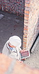 Architect, man or walking with tablet in construction site for building inspection or security check. Top view, civil engineer or contractor on technology for property design or architecture project