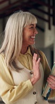 Education, smile and wave with teacher woman in class for curriculum, knowledge or syllabus. Confident, happy and hello with mature professor on college or university campus for study or teaching