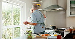 Dancing, cooking and senior couple in home kitchen with energy, bonding and love in marriage. Happy, food and ingredients for health and wellness with hug, music and people in house for retirement