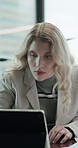 Finance, search and tablet with business woman at desk in office for accounting or bookkeeping. App, investment and risk management with accountant in financial workplace for planning or review