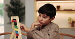 Child, learning and count in home with abacus, practice math and homework for education. Tired kid, calculate or development toys at house with growth, problem solving and number beads for solution 