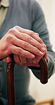 Cane, hands and retirement with old man in nursing home for healing or rehabilitation. Balance, walking stick and senior person with disability in apartment for healthcare, recovery or wellness