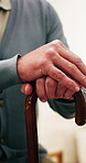 Hands, retirement and walking stick with old man in nursing home for healing or rehabilitation. Balance, cane and senior person with disability in apartment for healthcare, recovery or wellness