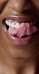 Licking, teeth and mouth with lip gloss, closeup and smile with cosmetic transformation or hydration. Beauty, makeup and happy person with glow, wellness and self care for healthy skin and shine