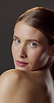 Skincare, face and woman with pride for glow, studio background and hydration with cosmetic benefits. Confident, portrait and person with healthy skin, beauty and shine with dermatology in Canada
