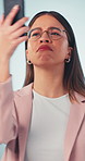 Confused, woman and bad signal with phone in studio for network error, issue or problem. Frustrated, female person or lost connection with mobile smartphone app for poor reception or cellular service