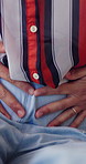 Upset, hurt and hands of woman with period pain, abdominal injury and discomfort for endometriosis. House, frustrated and closeup of person with cramps, tummy ache and bloating for menstrual cycle