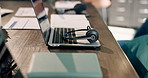 Headset, laptop and desk with paper in empty office for customer support, consulting and lead generation. Workplace, background and computer with mic for crm service, telemarketing and contact us
