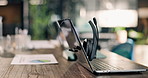 Empty, office and laptop with headset in call center for financial consulting, trading advice or investment. Documents, background and computer with mic for contact us, loan support or finance agency