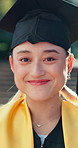 Student, face and asian woman with hat in graduation ceremony for academic achievement or milestone. Portrait, female person or graduate with smile for education, learning or university qualification